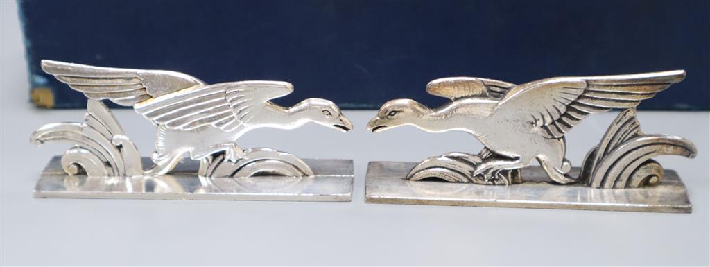 A set of twelve French Art Deco knife rests